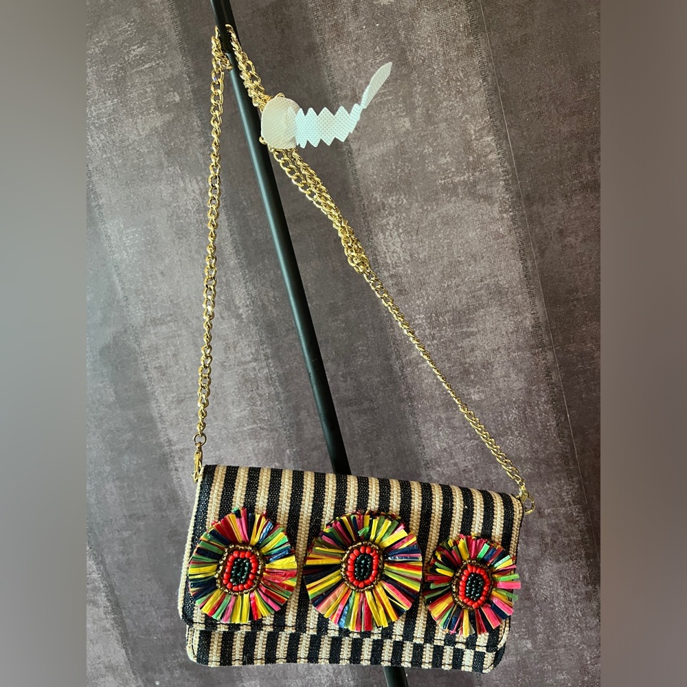 Shoulder/clutch bag with multicolored flowers and striped black and cream